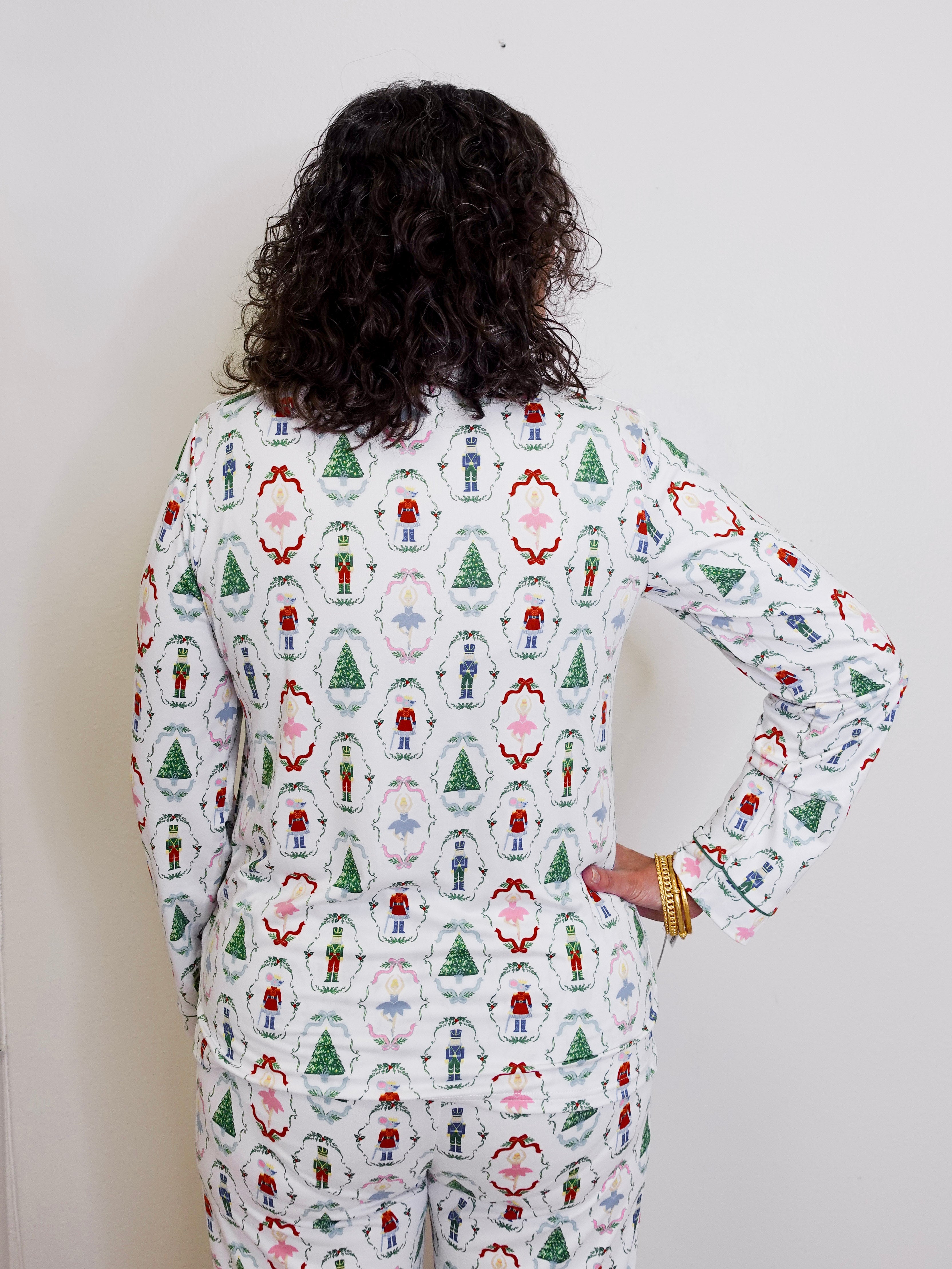 Person wearing a festive pajama set with a white background