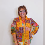 Woman wearing Ivy Jane patchwork top in multi-colored pattern
