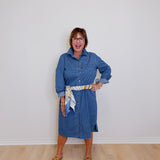 Woman wearing a blue dress with a white background