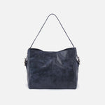 Navy blue handbag on a light gray background