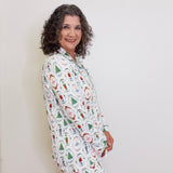 Woman wearing a patterned pajama set against a white background