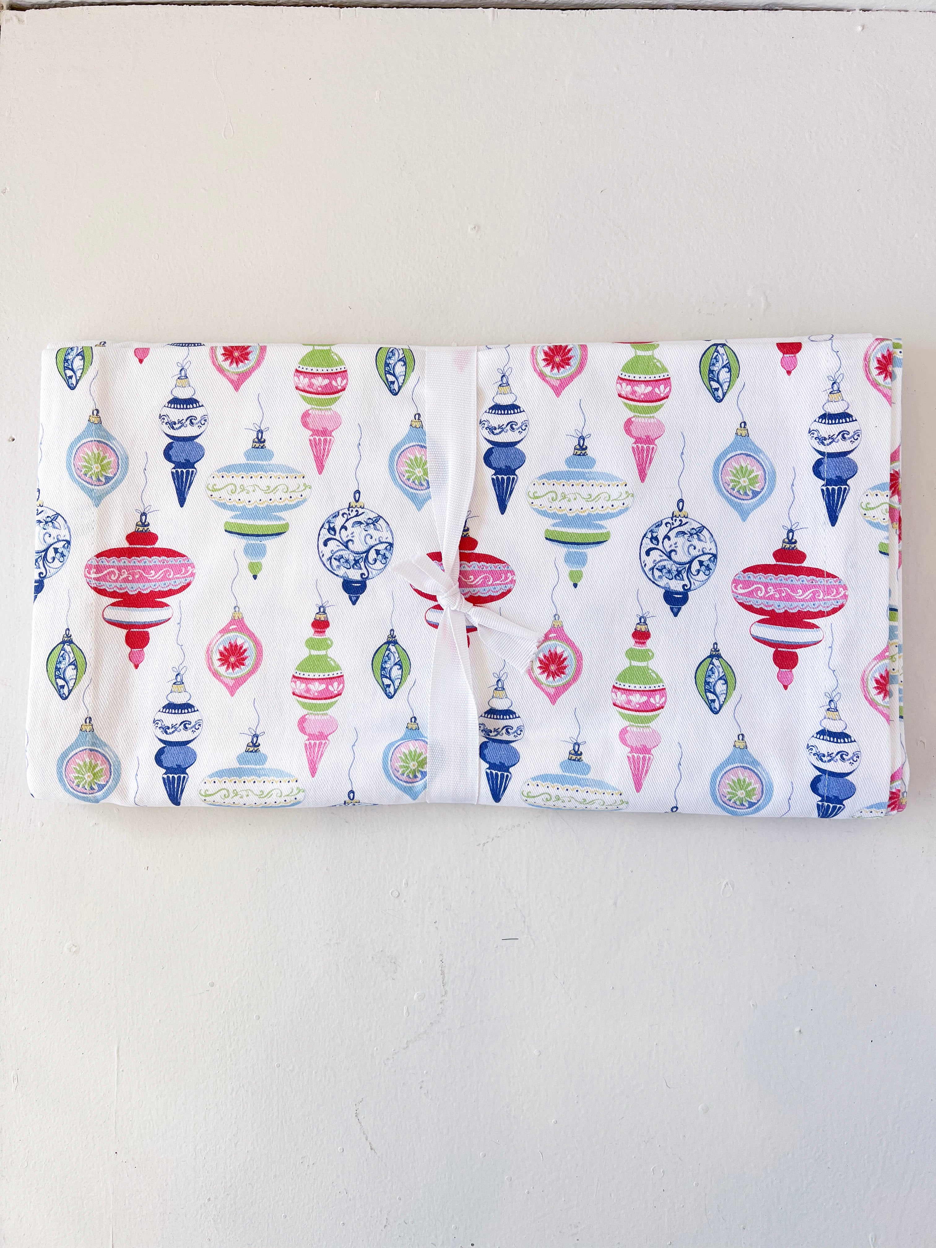 Flannel fabric with colorful Christmas ornament pattern on a white background