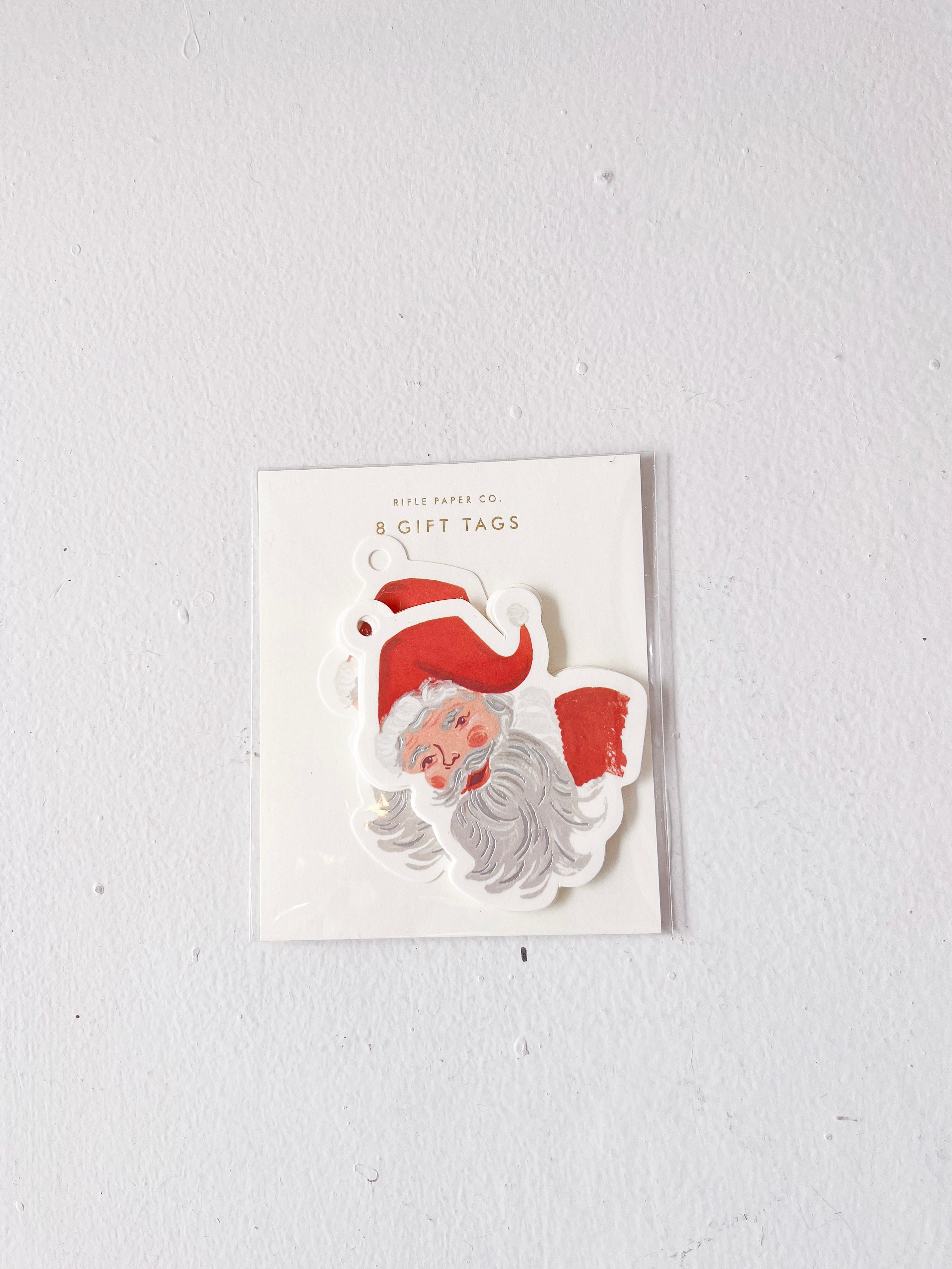 Pack of gift tags with Santa Claus design on a white background