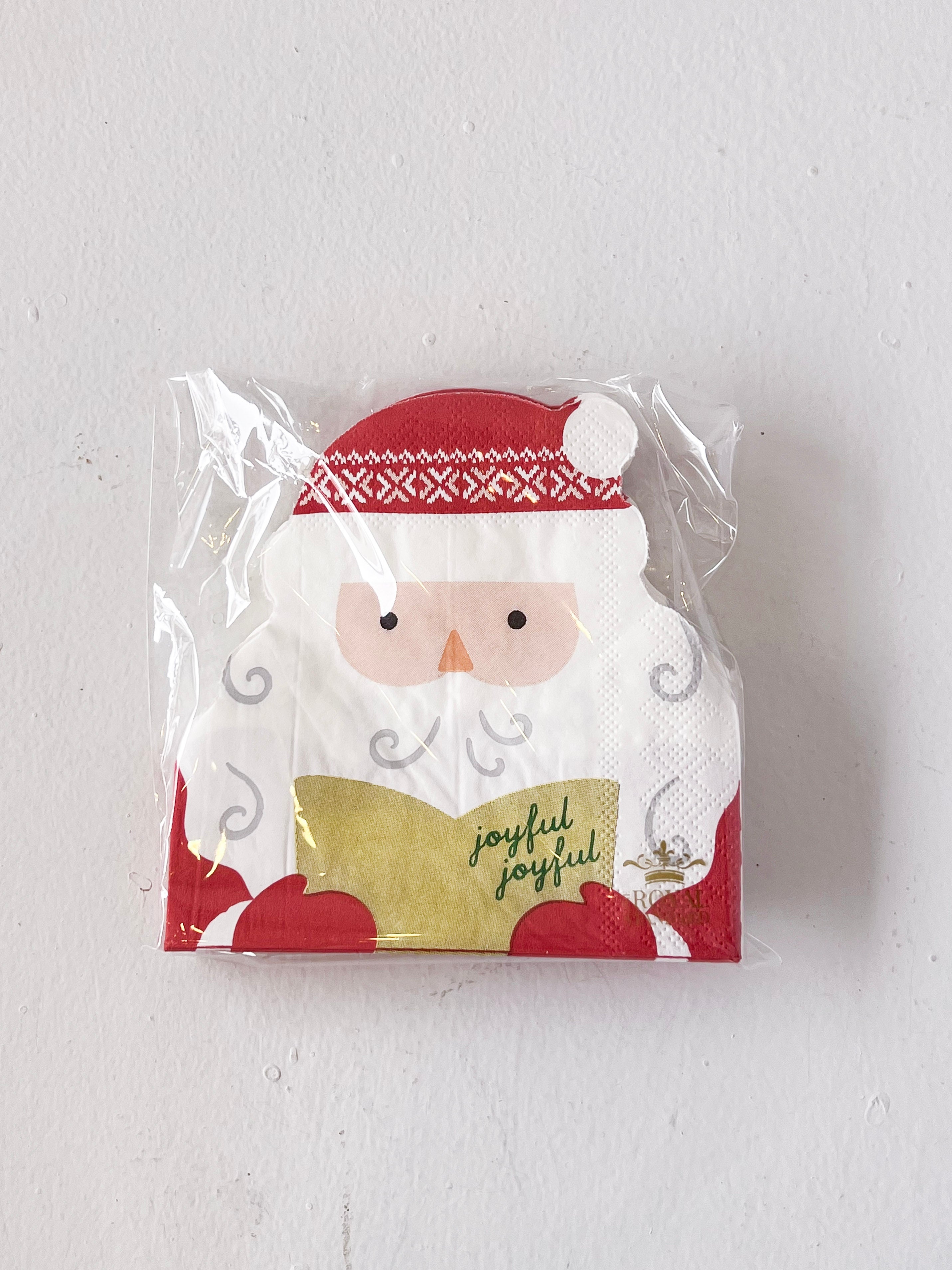 Packaged napkins with a Santa Claus design on a white background