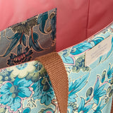 Close-up of a floral-patterned bag with a visible brand label.