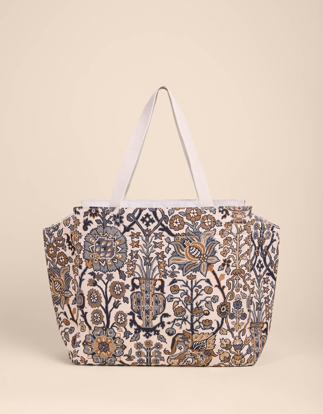 Floral patterned tote bag on a beige background