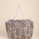 Floral patterned tote bag on a beige background