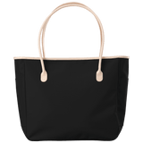 Black tote bag with beige handles on a transparent background