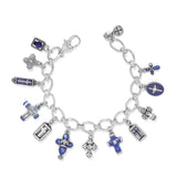 Silver charm bracelet with various charms on a white background