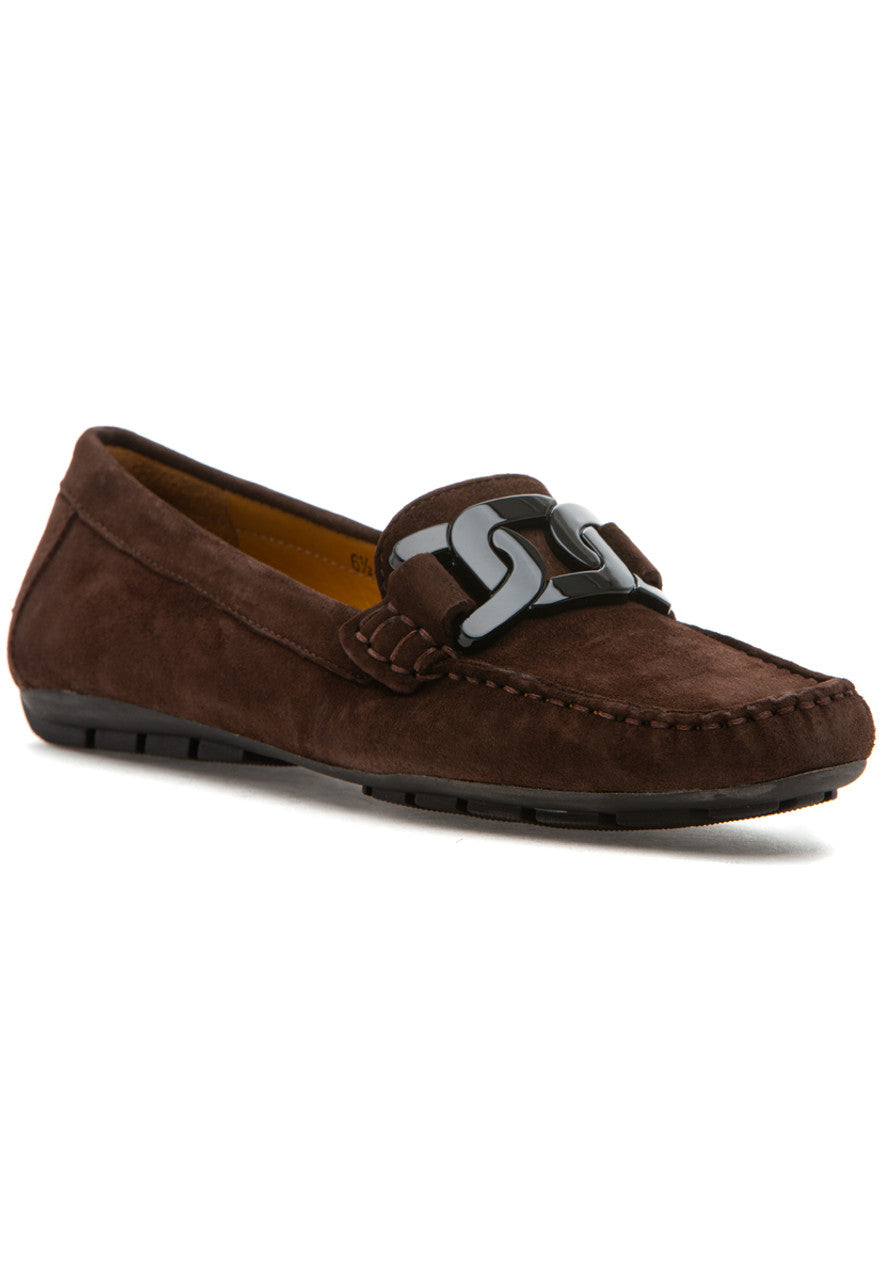 Brown suede loafer with a logo on a white background