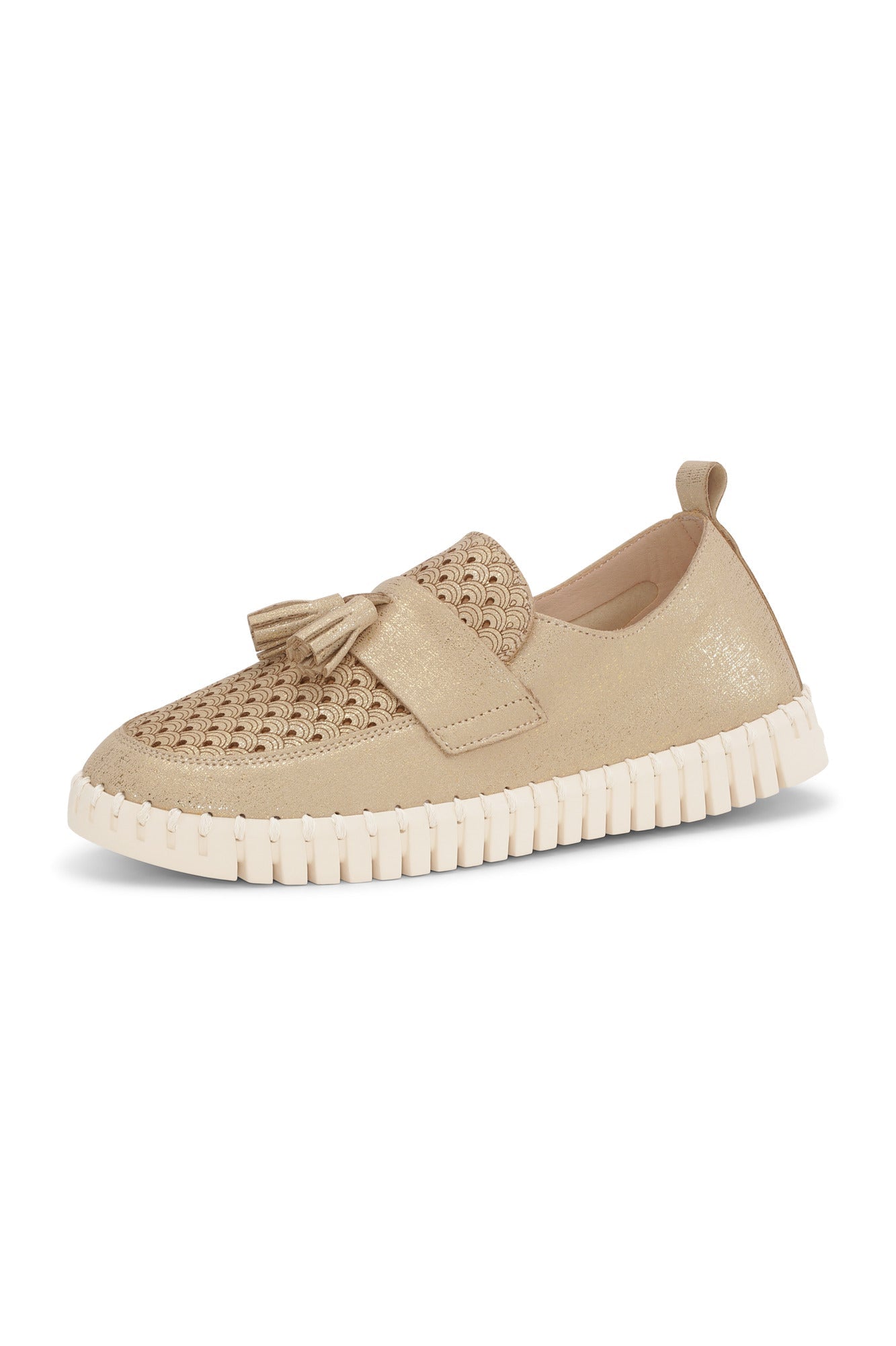 A gold loafer shoe with a tassel on top against a white background.