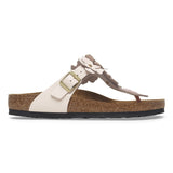 Sandal with floral design and buckle on a white background