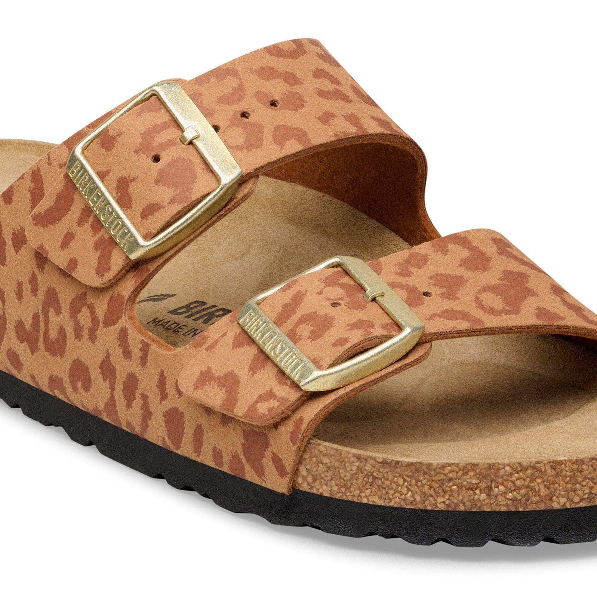 Brown leopard print sandal with gold buckles on a white background