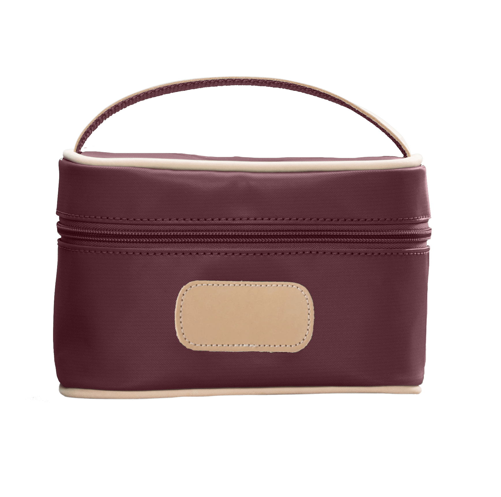 Burgundy cosmetic bag with beige handle and patch on a white background
