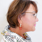 Woman wearing a colorful scarf with a white background