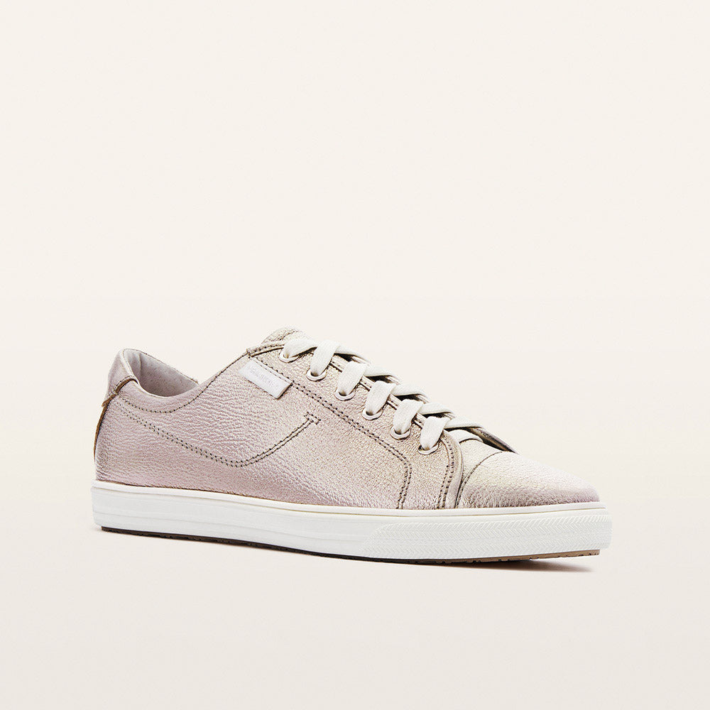 Beige sneaker on a light beige background