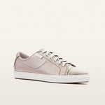 Beige sneaker on a light beige background