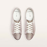 Pair of gray sneakers with white laces on a light gray background