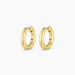 Gold hoop earrings on a white background