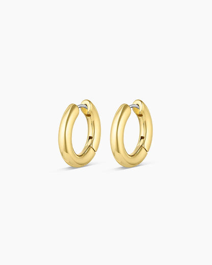 Gold hoop earrings on a white background