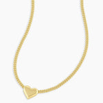 Gold heart-shaped pendant necklace on a white background