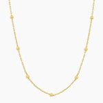 Gold necklace on a white background