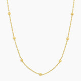 Gold necklace on a white background