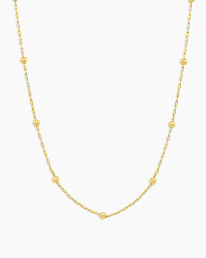 Gold necklace on a white background