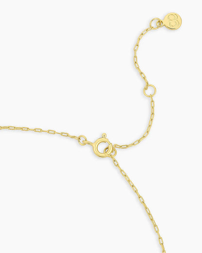 Gold bracelet on a white background