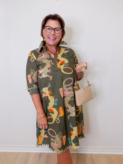 Woman wearing a patterned dress with a plain background