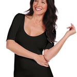 Woman wearing a black top on a white background