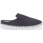 A single dark navy slip-on mule shoe with a white sole featuring black stitched detailing, shown against a plain white background.