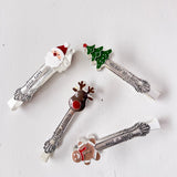 Set of Christmas-themed spoons on a light background