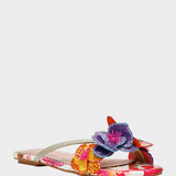 Colorful sandal with floral design on a white background