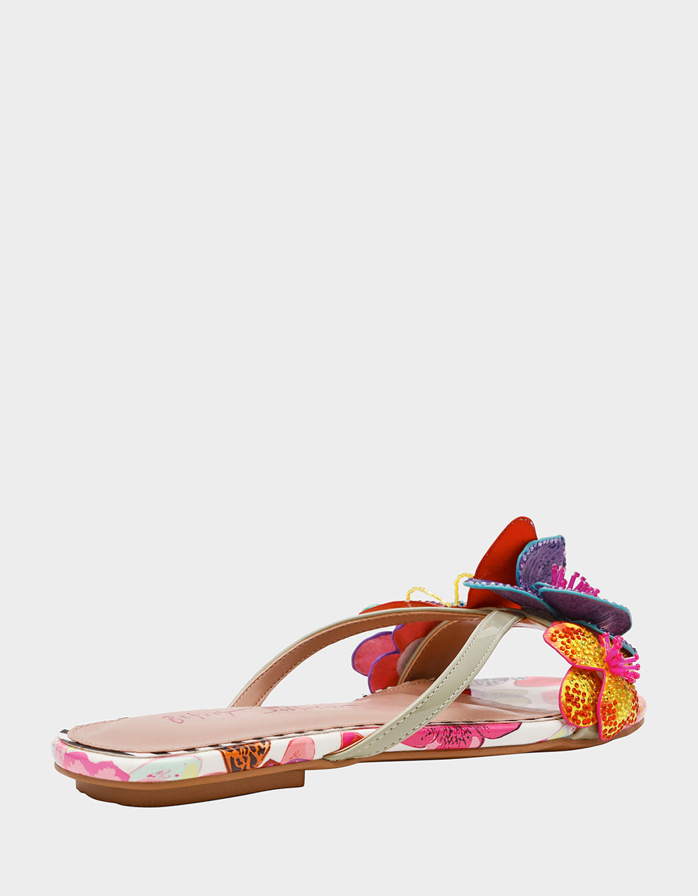 Colorful sandal with floral design on a white background