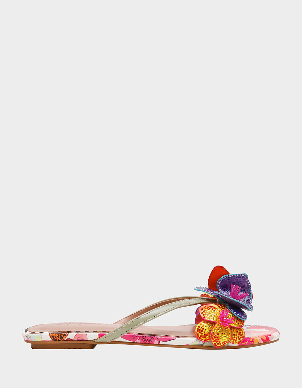 Colorful sandal with floral design on a white background