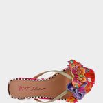 Colorful sandal with floral design on a white background