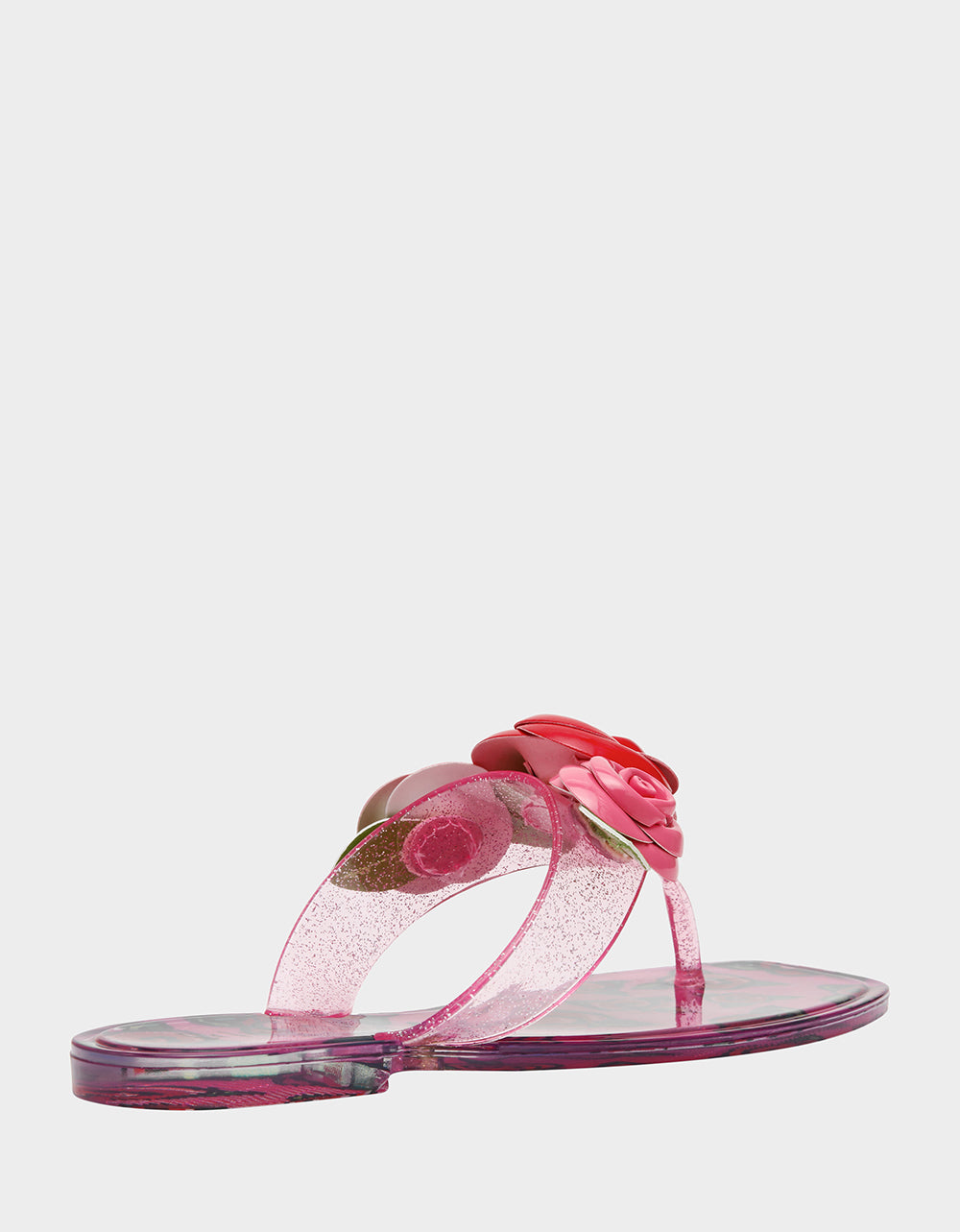 Pink sandal with floral design on a white background