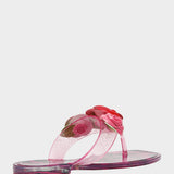 Pink sandal with floral design on a white background