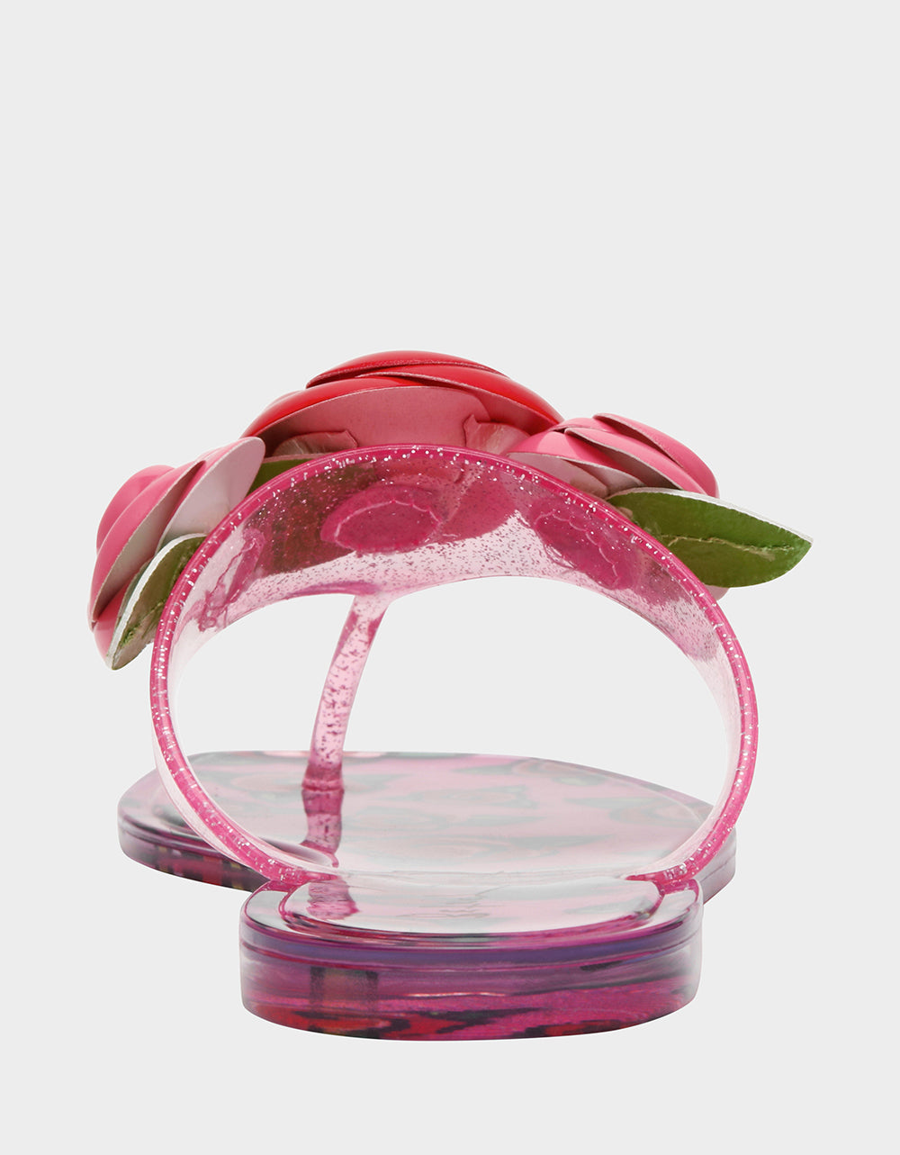 Pink sandals with floral design on a light gray background