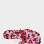 Pink sandal with red rose pattern on a white background