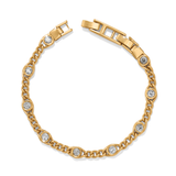 Gold bracelet with diamond accents on a white background