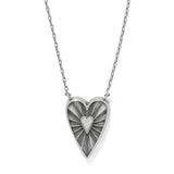 Heart-shaped pendant necklace with a sunburst design on a white background