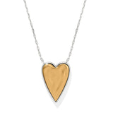 Heart-shaped necklace with gold and silver design on a white background