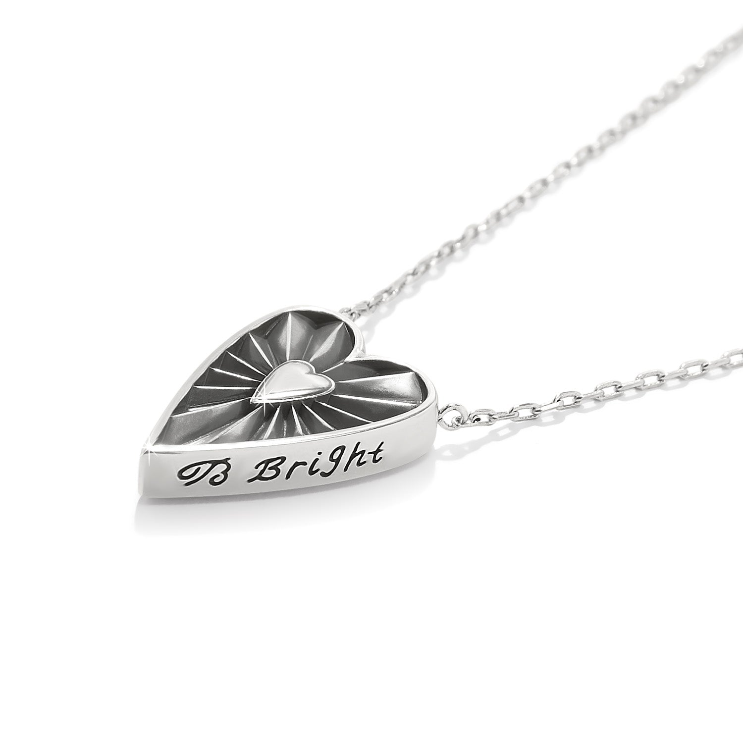 Silver necklace with a heart-shaped pendant on a white background