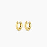 Pair of gold hoop earrings on a white background