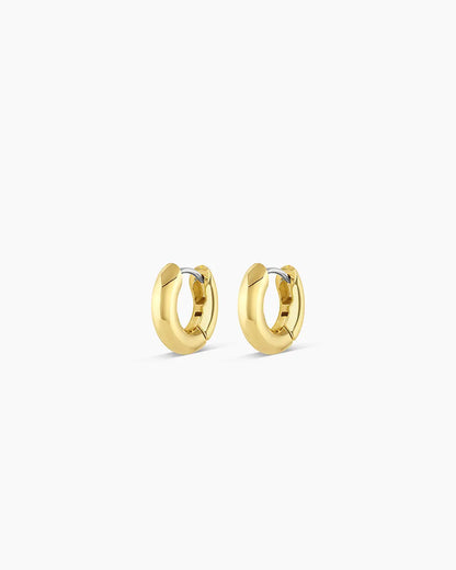 Pair of gold hoop earrings on a white background