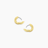 Gold hoop earrings on a white background