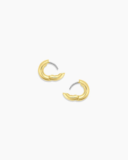 Gold hoop earrings on a white background