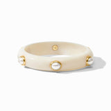 Beige bracelet with gold accents and pearl-like beads on a white background